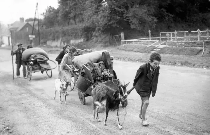 Framed Print : Dispalced French families returning to the town of Faliaise in Normandy