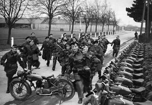 Dispatch riders of the East Riding Yeomanry make a dash for their vehicles when the alarm