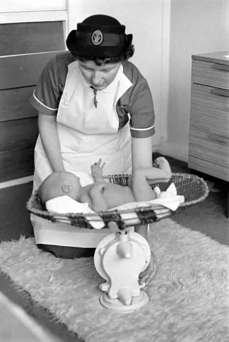Framed Print : The District Nurse, General scenes of District nurse Muggendge paying a newly born baby a Framed Print : The District Nurse, General scenes of District nurse Muggendge paying a newly born baby a
