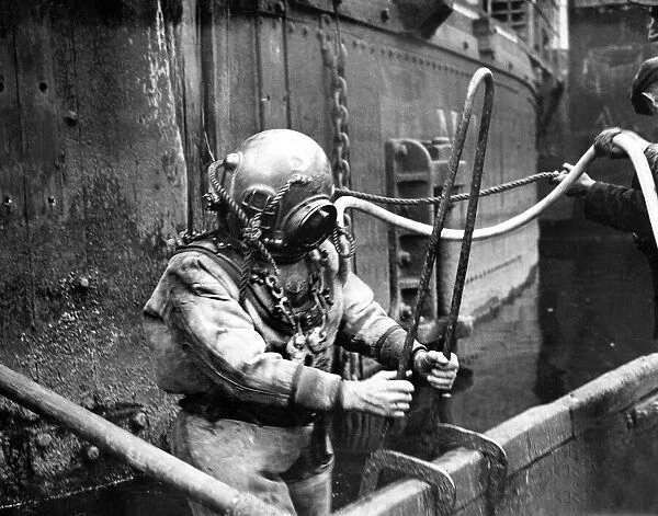 A diver in an old fashioned suit that you had to be bolted into