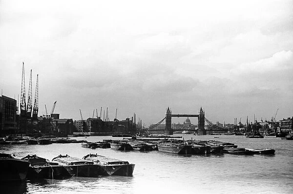 The docks and the River Thames looking towards Tower Bridge and St Pauls Cathedral