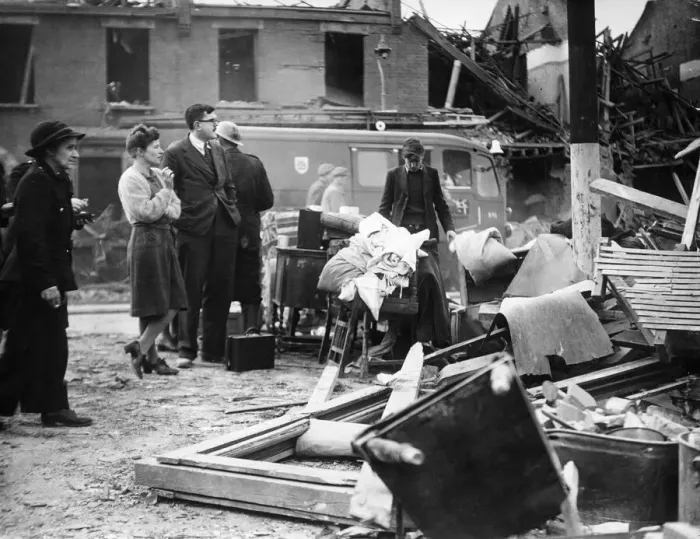 Framed Print : Doctor Waters, wearing glasses, watches rescue work in progress after a V2 Bomb fell Framed Print : Doctor Waters, wearing glasses, watches rescue work in progress after a V2 Bomb fell