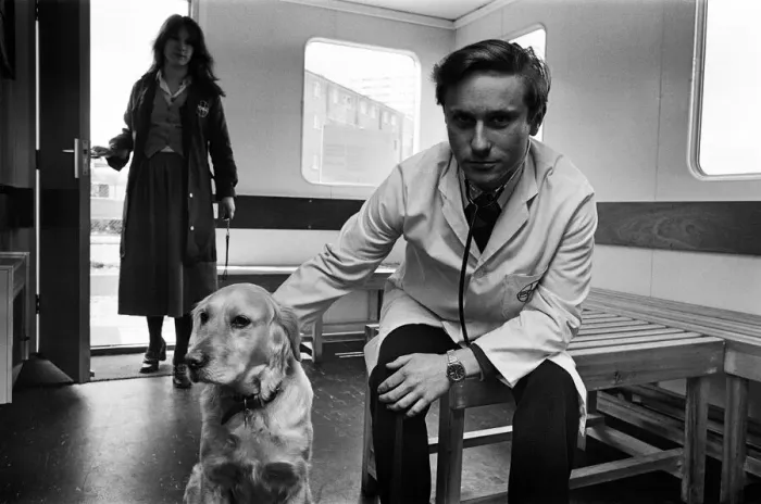 Framed Print : Its a dog life for this Birmingham vet. He is stationed in a mobile hut on land in Framed Print : Its a dog life for this Birmingham vet. He is stationed in a mobile hut on land in