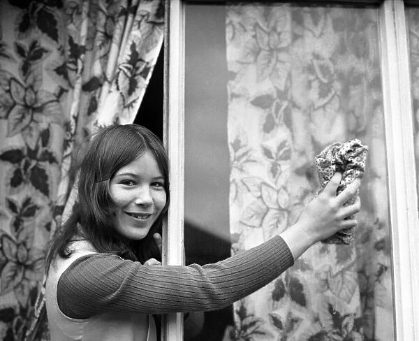 Domestic Life: Teenager Jeanette Green doing household chores at her home - here cleaning