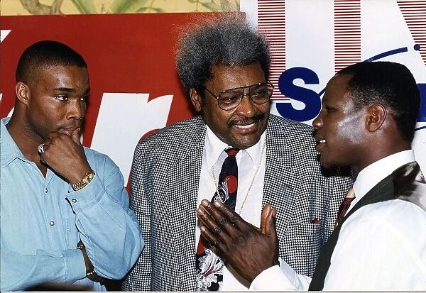 Don King Boxing promoter talks with Chris Eubank on his right