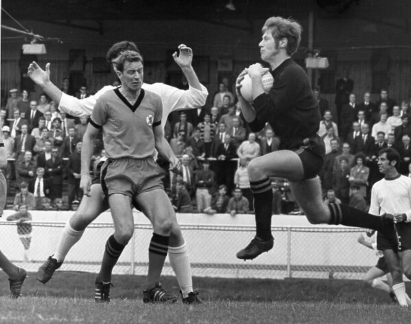 Donald MacKay Dundee United goalkeeper catches the ball as team mate centre half Doug