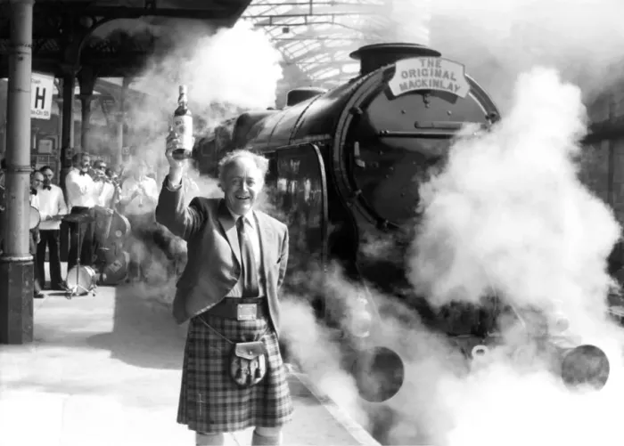 Framed Print : Donald Mackinlay of distillers Charles Mackinlay toasts the departure of the 1926 Lord