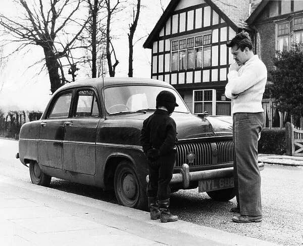 Donald Sinden and son Jeremy inspect their very dusty and grimy Consul