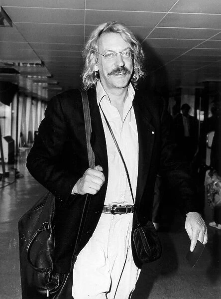 Donald Sutherland leaving Heathrow airport for New York by Concorde