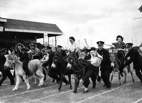 The donkey Derby, in progress, the jockeys were girls drawn from the different areas of