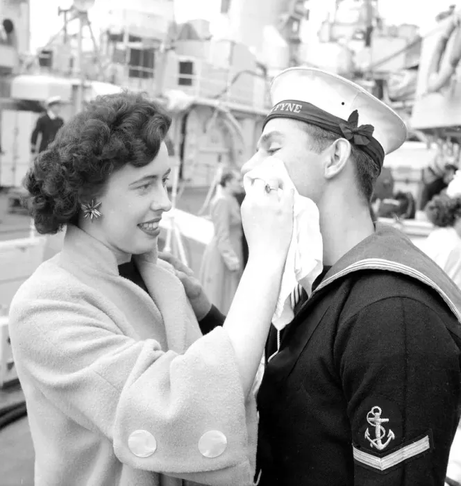 Framed Print : Dorothy Phillips wiping off the lipstick mark after kissing her boyfriend and sailor L. M Framed Print : Dorothy Phillips wiping off the lipstick mark after kissing her boyfriend and sailor L. M