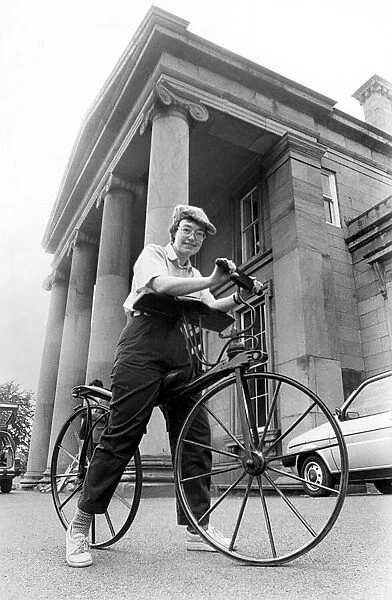 Dr. Helen Sinclair tries out the oldest bicycle on show at Monkwearmouth Museum