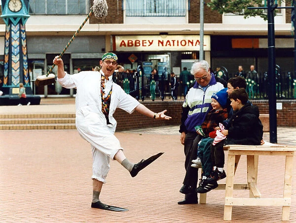 Dr Percy Percil keeps the locals amused at Kirkby shopping centre as they helped