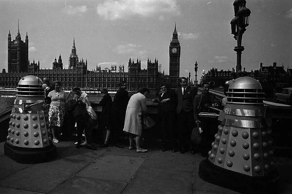 Dr Who Daleks with people opposite Houses of Parliament