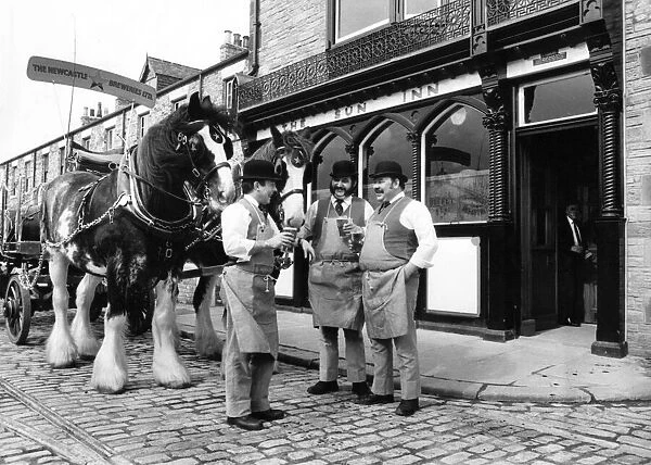 Draymen of yesteryear enjoy a pint outside The Sun Inn at Beamish Museum