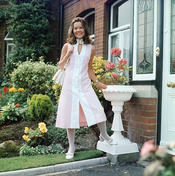 Dress designer Glynis Robins, 23, pictured wearing one of her own designs - a midi dress