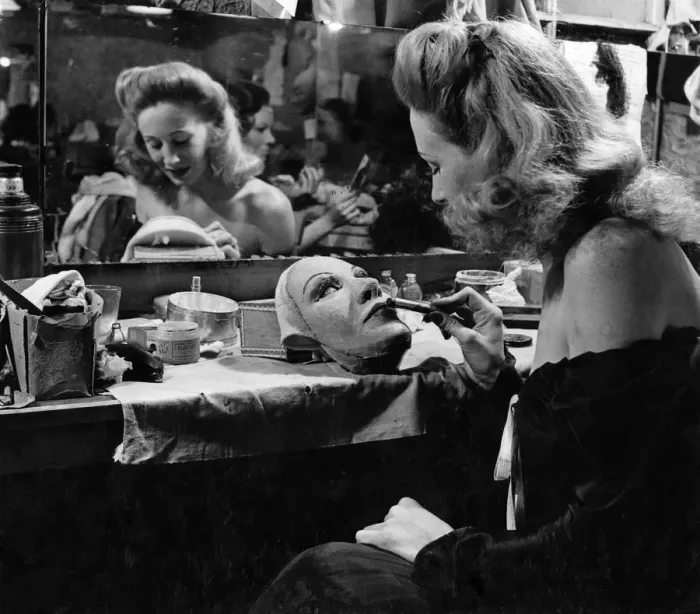 Framed Print : In the dressing rooms of the London Palladium we see Carol Trent making up her mask which