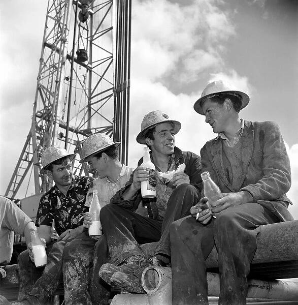 Drilling for oil in Ireland. Irish workers enjoy a lunch break beneath the rig