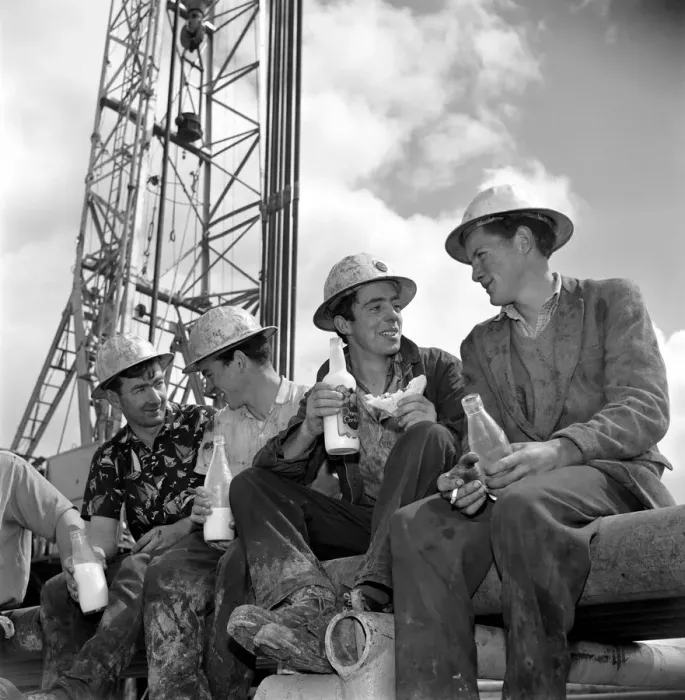 Framed Print : Drilling for oil in Ireland. Irish workers enjoy a lunch break beneath the rig Framed Print : Drilling for oil in Ireland. Irish workers enjoy a lunch break beneath the rig