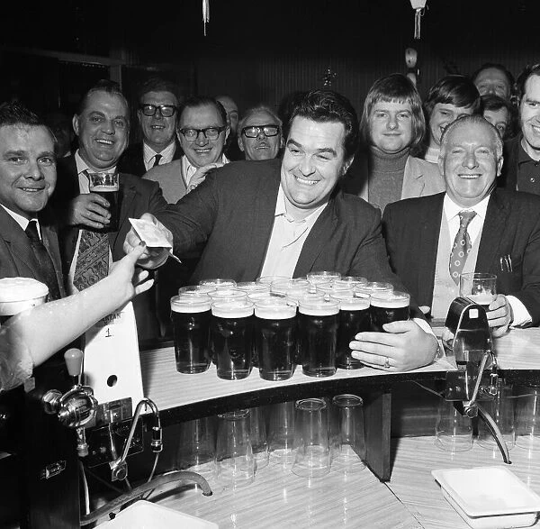 A drinkers dream - man with twenty pints in the pub. 1st January 1973