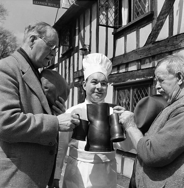 Drinking the health of the Queen from black Jack beer mugs. May 1953 D2430-001