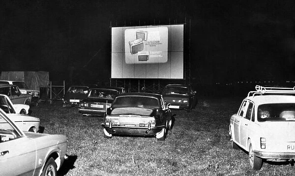 Drive In Cinema, in farmer Swinburnes cow pasture, with silos in the background