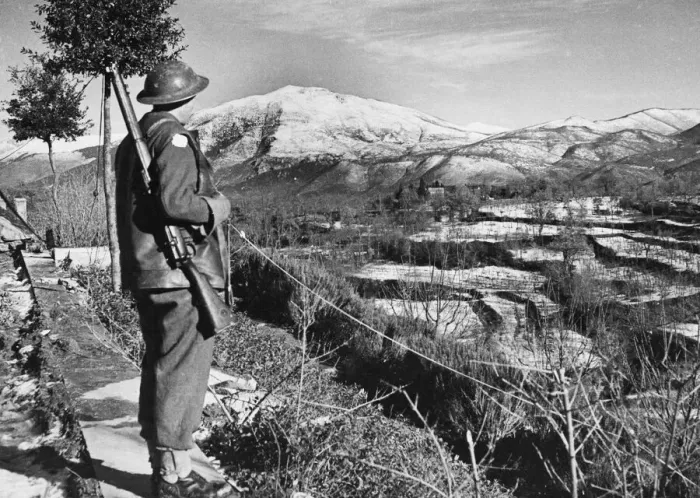 Framed Print : Driver C. A. Langford looks over snow covered territory of an American held sector
