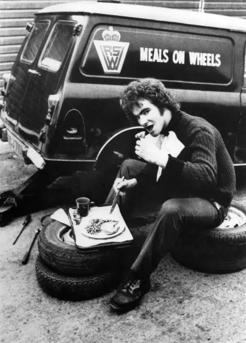 Framed Print : Driver makes the most of the food and has a spot of lunch while the meals on wheels van Framed Print : Driver makes the most of the food and has a spot of lunch while the meals on wheels van