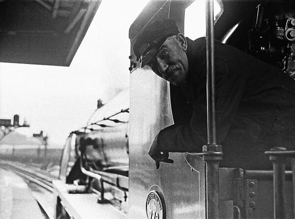 The driver Southern Railways King Arthur Class locomotive Sir Percivale awaits the signal