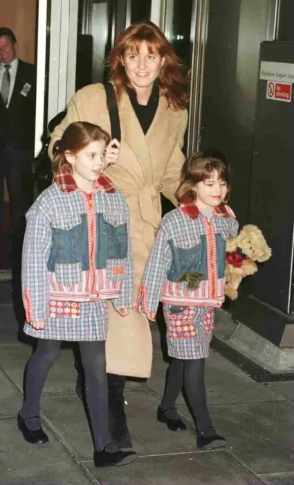 Framed Print : Duchess Of York and children Princess Beatrice and Princess Eugenie leave Heathrow for