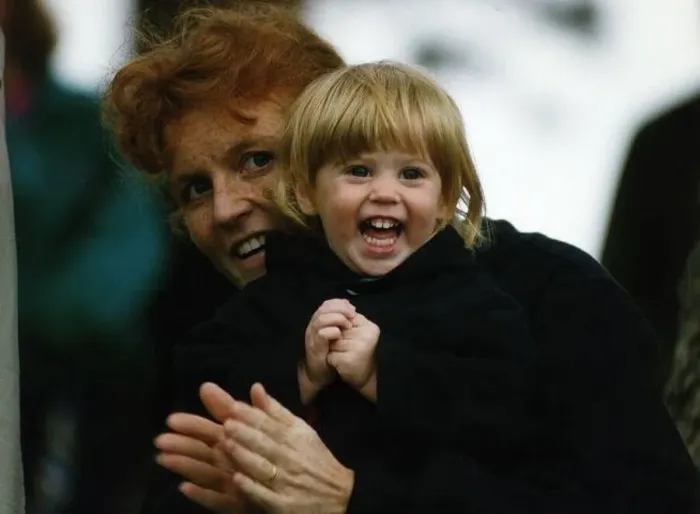  : Duchess of York holds Beatrice tightly after having her pigtails pulled