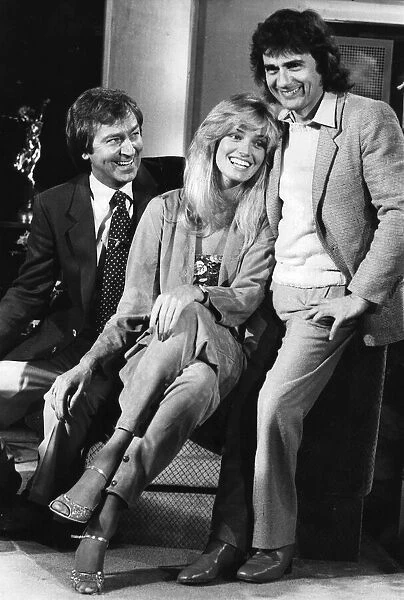 Dudley Moore and Susan Anton laughing during filming interview with Des O