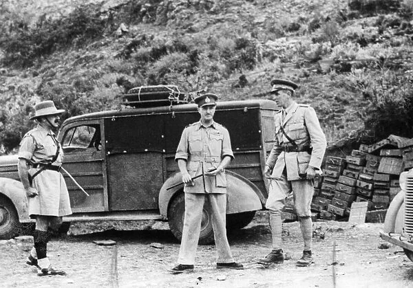 The Duke of Aosta (right) after his surrender, escorted from the cave where he lived at