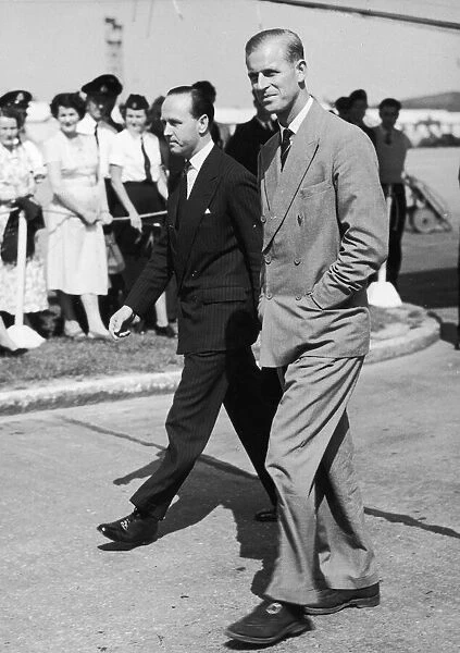 The Duke of Edinburgh arrives home on leave. Pictured with his private secretary Mike