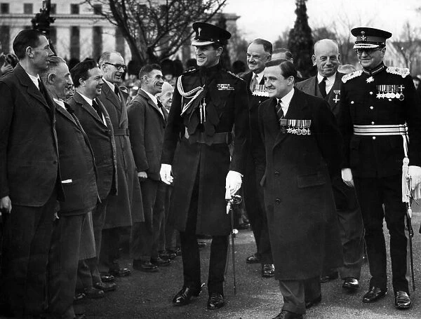 The Duke of Edinburgh, escorted by Major Tasker Watkins VC talking to some of