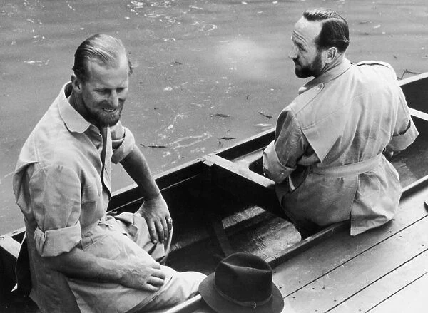 The Duke of Edinburgh and Lieutenant-Commander Parker in a canoe during his visit to