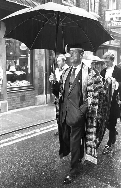 The Duke of Edinburgh. Prince Philip holding an umbrella. May 1986