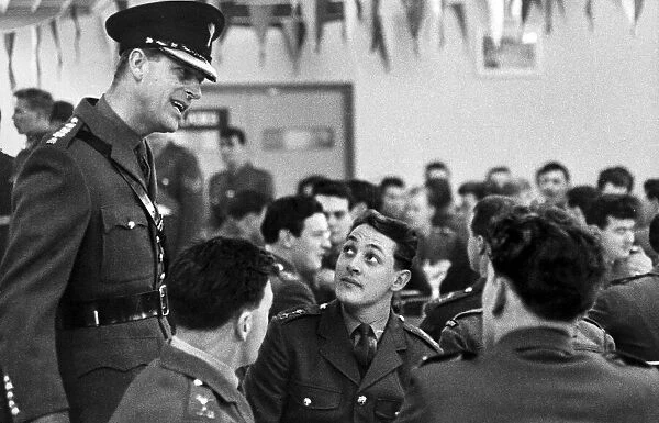 Duke of Edinburgh, Prince Philip talking to soldiers in mess hall in uniform - March 1964