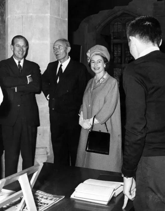 Framed Print : The Duke of Edinburgh, Rear Admiral D. J Hoare and The Queen share a joke with a student Framed Print : The Duke of Edinburgh, Rear Admiral D. J Hoare and The Queen share a joke with a student