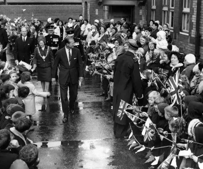 Framed Print : The Duke of Edinburgh walks through the lines of flag waving pupils at Kitchener Road Framed Print : The Duke of Edinburgh walks through the lines of flag waving pupils at Kitchener Road