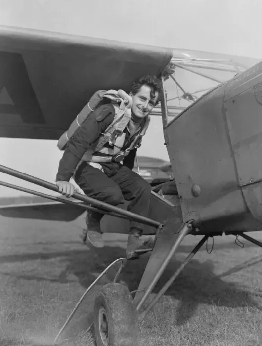 Framed Print : Dumbo Williams film stunt man seen here climbing into a Auster light aircraft Framed Print : Dumbo Williams film stunt man seen here climbing into a Auster light aircraft
