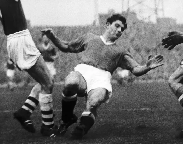 Framed Print : Duncan Edwards of Manchester United makes a sliding tackle 1957 Framed Print : Duncan Edwards of Manchester United makes a sliding tackle 1957