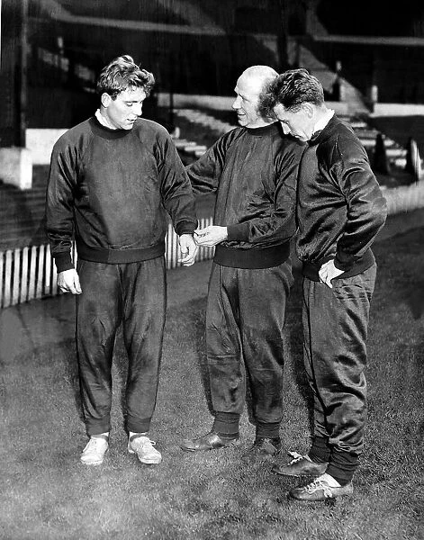 Duncan Edwards with Matt Busby and Roger Byrne November 1957 trying on new