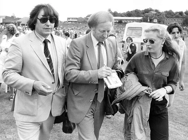 Durham Miners Gala - Arthur Scargill with Roland Boyes, signs an autograph as he leaves