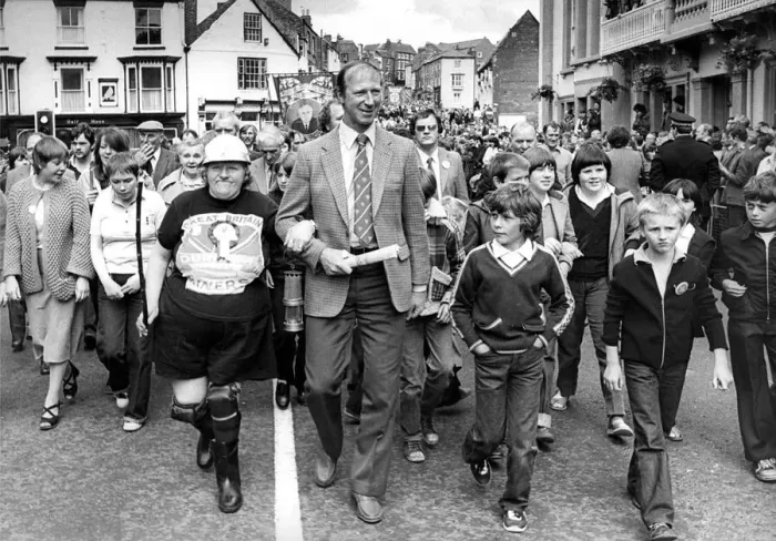 Framed Print : Durham Miners Gala - Jack Charlton links arms with 62-year-old Lousie Bradshaw Framed Print : Durham Miners Gala - Jack Charlton links arms with 62-year-old Lousie Bradshaw