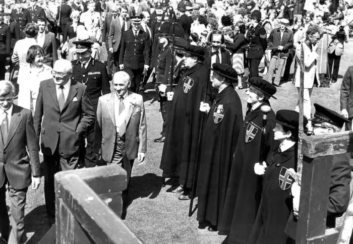 Framed Print : Durham Miners Gala - Jim Callaghan walks past the Mayors Bodyguard on his way to Framed Print : Durham Miners Gala - Jim Callaghan walks past the Mayors Bodyguard on his way to