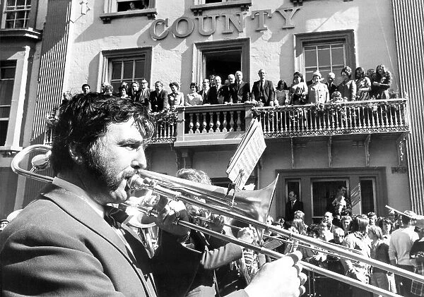 Durham Miners Gala - VIPs line up on the Royal County Hotel balcony as a colliery band