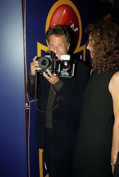 Dustin Hoffman Actor August 98 Holding a camera at the premiere of Lock Stock And