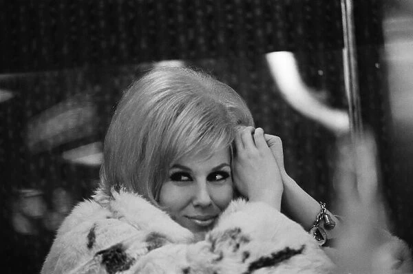 Dusty Springfield, popular English singer, is riding high on the wave of her successful