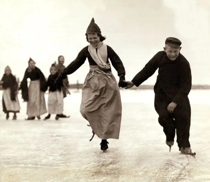 Framed Print : Dutch children skating on the frozen inland sea near their home of Volendam, Holland Framed Print : Dutch children skating on the frozen inland sea near their home of Volendam, Holland
